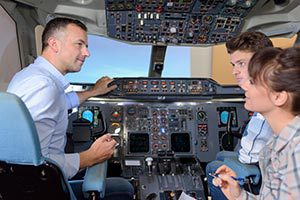 Flight Instrument Instructor in Cockpit with Students