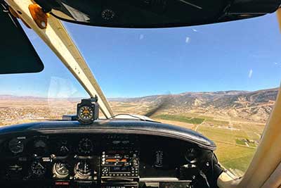 Dashboard of small plane in the air