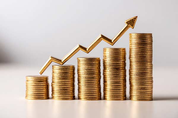 Stacked golden coins depicting increased wealth